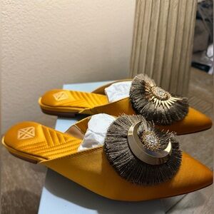 ANTONIO MELANI Gold Mules with Fringe Detail